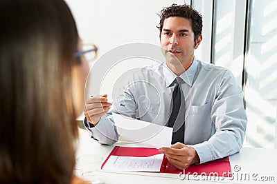 Businessman Interviewing Female Candidate Stock Photo