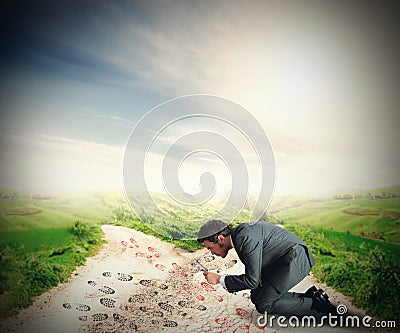 Businessman investigates the footsteps Stock Photo