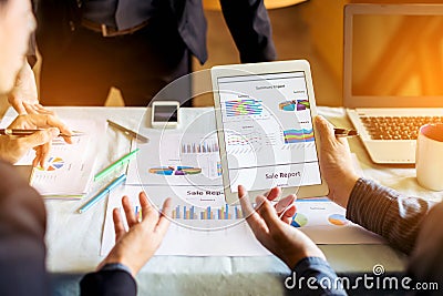 Businessman investment consultant analyzing company financial report balance sheet statement working with digital graphs. Concept Stock Photo