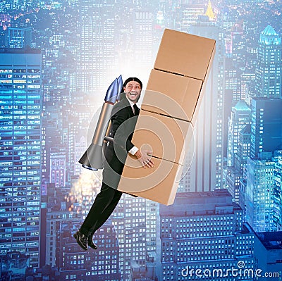 Businessman with jetpack delivering boxes globally Stock Photo