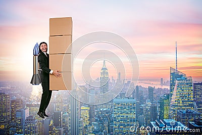 The businessman with jetpack delivering boxes globally Stock Photo