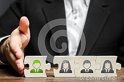 A businessman joins a new employee to the team as its leader. Hiring new employees for the project., teamwork. Stock Photo