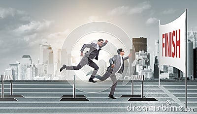 The businessman jumping over barriers in business concept Stock Photo