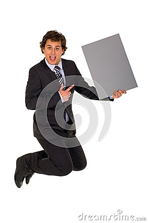 Businessman jumping with poster Stock Photo