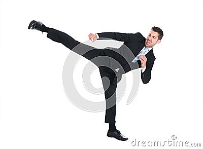 Businessman kicking over white background Stock Photo