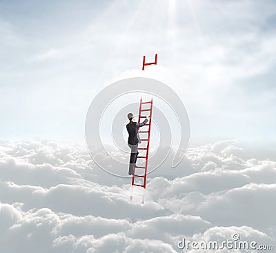 Businessman on ladder Stock Photo