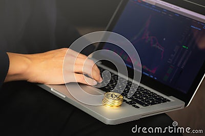 Businessman on laptop with bitcoin coins Stock Photo