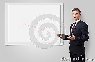 Businessman with laser pointer and copyspace white blackboard Stock Photo