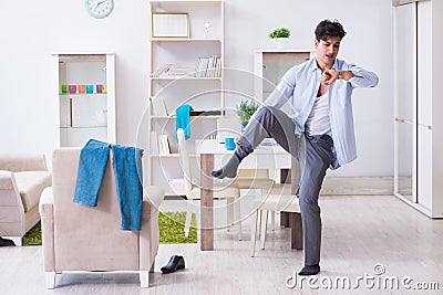 Businessman late for office due to oversleeping after overnight Stock Photo