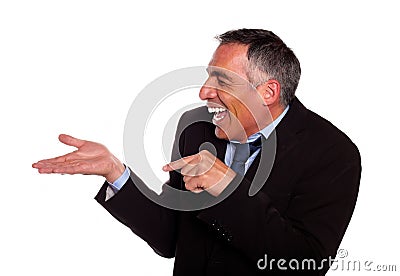 Businessman laughing and pointing extended hand Stock Photo