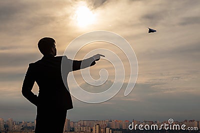 Businessman launches an airplane Stock Photo