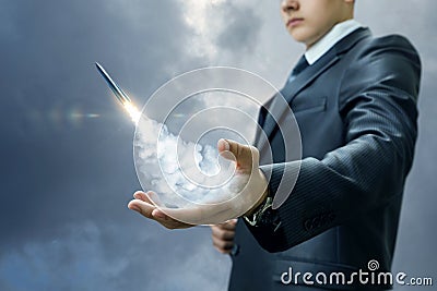 Businessman launches a missile from the hand. Stock Photo