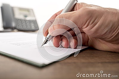Businessman or lawyer signing important document Stock Photo