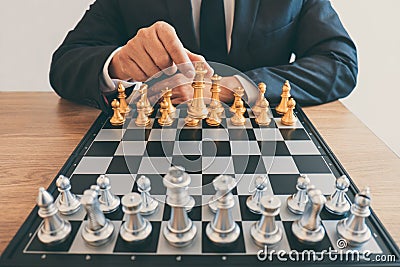 Businessman leadership playing chess and thinking strategy plan about crash overthrow the opposite team and development analyze Stock Photo