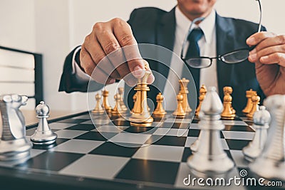 Businessman leadership playing chess and thinking strategy plan about crash overthrow the opposite team and development analyze Stock Photo