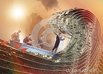 Businessman leading his team through wave of dollars Stock Photo