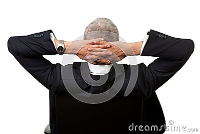 Businessman leaning back in the chair Stock Photo