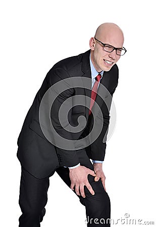 Businessman with leg pain or cramps Stock Photo