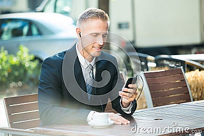 Businessman Listening Music Stock Photo