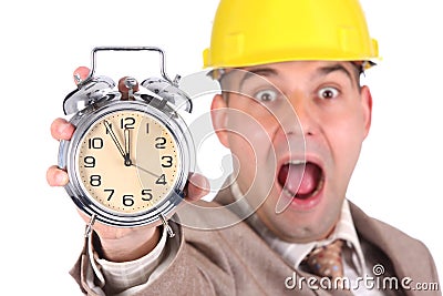 Businessman looking at clock alarm Stock Photo