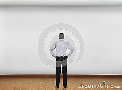 Businessman looking at wall Stock Photo