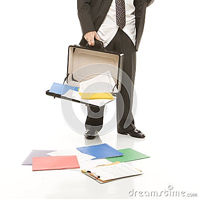 Businessman losing papers Stock Photo