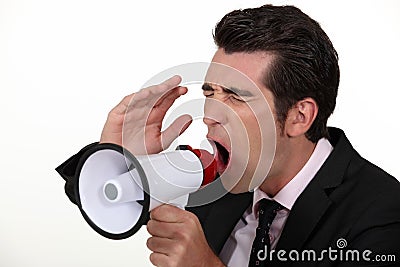 Businessman with a loudhailer. Stock Photo