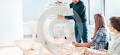 Businessman makes a report at a meeting with the business team Stock Photo