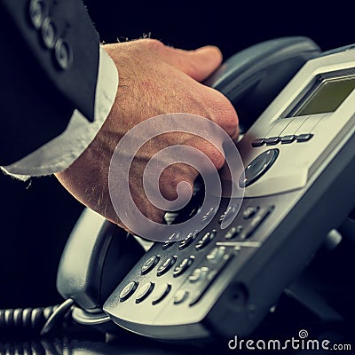 Businessman making a call on a telephone Stock Photo