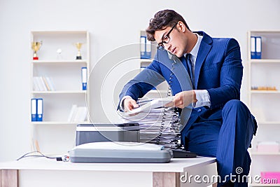 The businessman making copies in copying machine Stock Photo