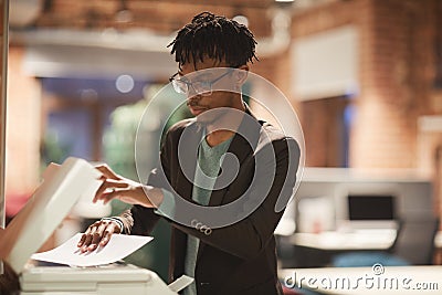 Businessman making a copy at office Stock Photo