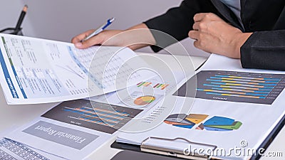 Businessman or Manager work with financial paper report, Stock Photo