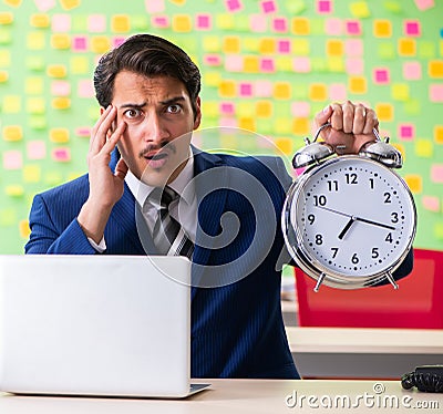 Businessman with many conflicting priorities in time management Stock Photo