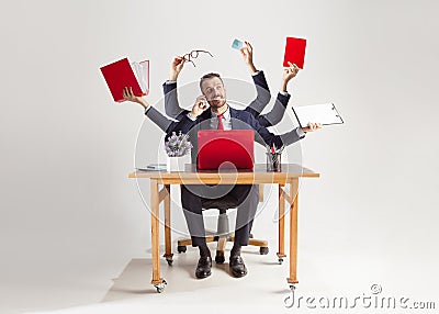 Businessman with many hands in elegant suit working with paper, document, contract, folder, business plan. Stock Photo
