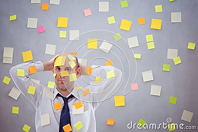 Businessman with many notes Stock Photo