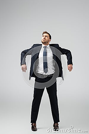 Businessman marionette in suit posing with Stock Photo