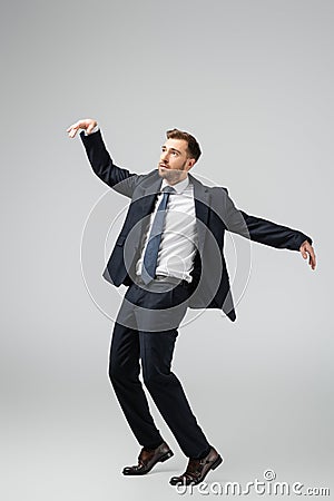 Businessman marionette in suit posing with Stock Photo