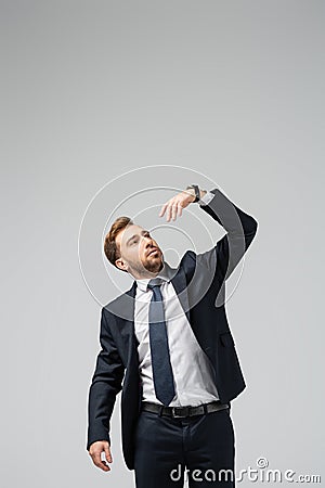 Businessman marionette in suit with raised Stock Photo
