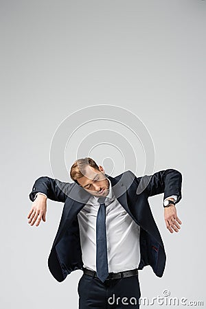 Businessman marionette in suit with raised Stock Photo