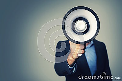 Businessman with megaphone in hand Stock Photo