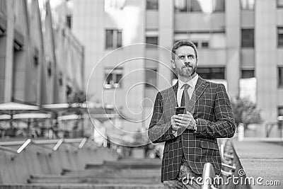 businessman messaging on phone outdoor, copy space. businessman messaging on phone Stock Photo