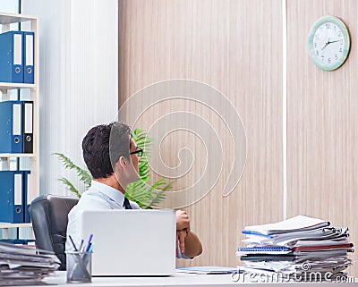 Businessman missing deadline for deliverables in office Stock Photo