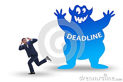 Businessman missing important deadline with monster Stock Photo