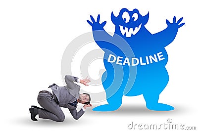 Businessman missing important deadline with monster Stock Photo