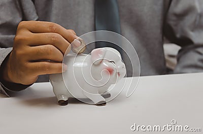 Businessman money coin financial tax and planning investments marketing economy income and retirement saving Stock Photo