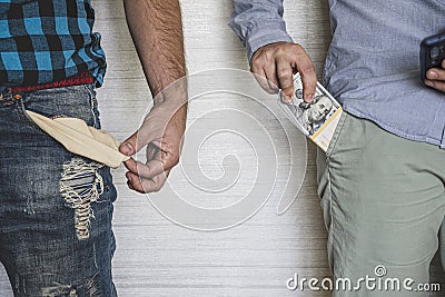 businessman with money in his pocket and a poor worker with an empty pocket. The concept of income inequality of the population. Stock Photo