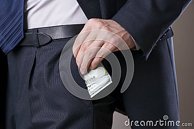 Businessman with money in studio Stock Photo