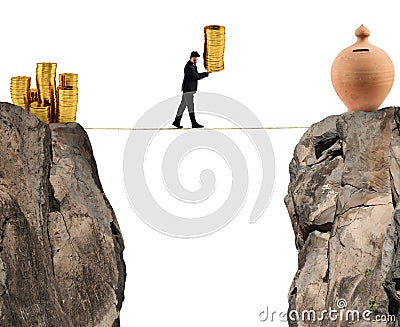 Businessman moves a pile of coins to a moneybox. concept of difficulty to saving money Stock Photo