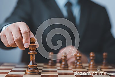 Businessman moving chess piece on chess board game concept for ideas and competition Stock Photo