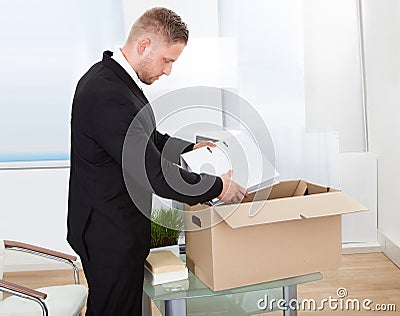 Businessman moving offices Stock Photo